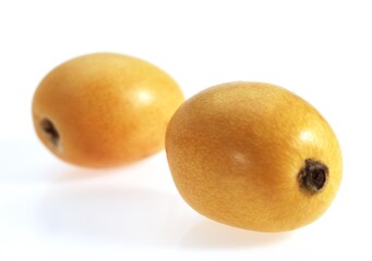 Medlars, eriobotrya japonica, Fruits against White Background