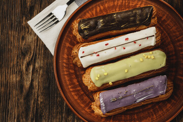 Group of colorful eclair cakes close up