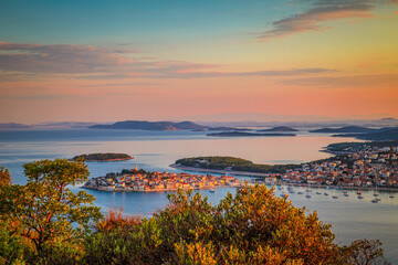 Panoramic view of Adriatic coast with The Primosten town at the colorful dawn of the day, Croatia, Europe.