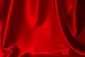 Red silk or satin luxury fabric texture can use as abstract background.
