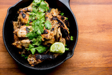Grilled chicken. BBQ Chicken grilled in garlic and butter. Chicken, fried & served w/ bbq side dishes, organic vegetables and dressed in olive oil. Classic American outdoor grill entree favorite.