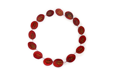 Frame of  autumnal red leaves with natural pattern of yellow spots on a white background with space for text. Top view, flat lay