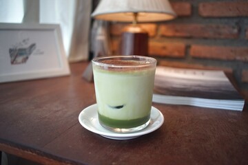 Iced green tea milk  in a cafe