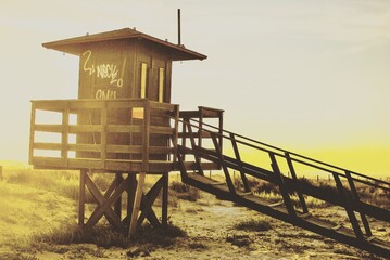 Fototapeta na wymiar lifeguard tower at sunset