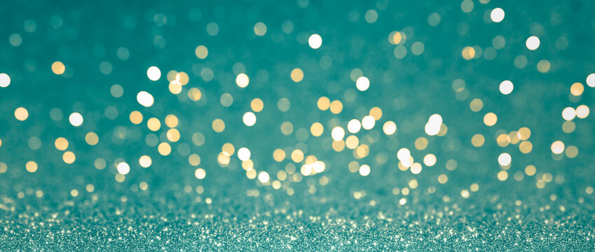 Abstract blurred background, yellow lights on blue background. Golden christmas or new year bokeh.