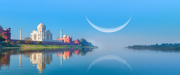Taj Mahal mausoleum reflected in Yamuna river with crescent moon - Agra, Uttar Pradesh, India