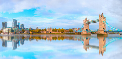 Naklejka premium Panorama of the Tower Bridge, Tower of London and modern skyline on Thames river - London, United Kingdom