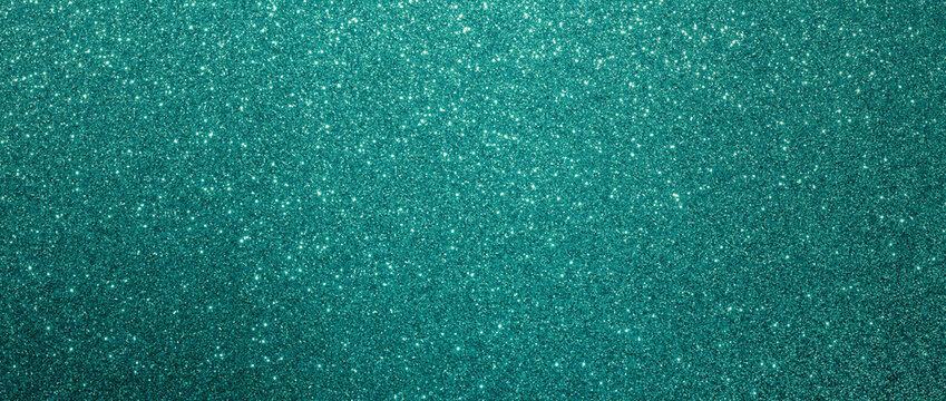 Green glitter christmas background. Close-up shot of glittery texture or new year or valentine day designs.