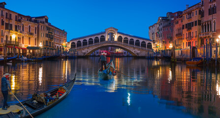 Fototapeta na wymiar Gondola near Rialto Bridge in Venice, Italy