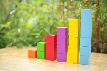 stack of colorful wood cube building blocks