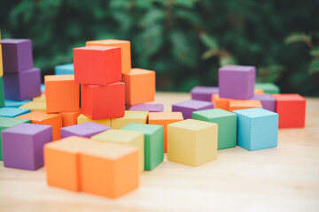 Fototapeta premium stack of colorful wood cube building blocks