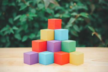 Obraz premium stack of colorful wood cube building blocks