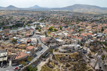 Fototapeta na wymiar Amazing view to the cave town Uchisar from the ancient mountain fortress. Cappadocia, Turkey.