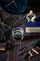 still life with a bottle of wine and a clock