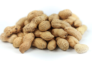 peanut grain in peel on white background