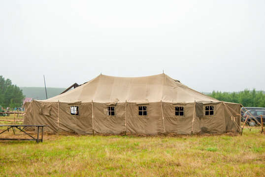 Tent military USB-56, installed on the field, in the open air. The tent is used for temporary housing of military personnel.