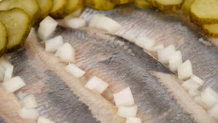 Holland Soused herring with onion and dill pickles cucumbers