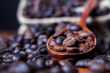 Roasted coffee beans in the wooden spoon