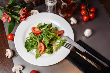 Caesar salad with chicken, cherry tomatoes, lettuce