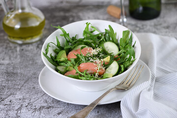 Vegetable salad with red fish.