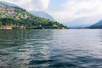 View of Lake Como, coastal towns and the surrounding mountains