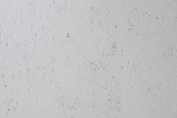 gray painted fiberboard texture with cracks and scuffs. Abstract background for design and decoration