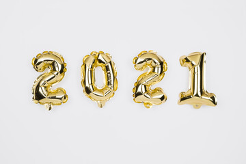 Happy New year 2021 celebration. Gold foil balloons numeral 2020 on white background