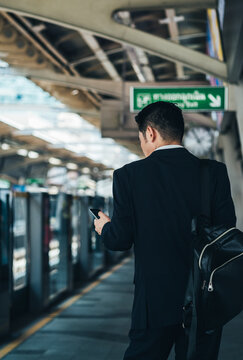 Back view of businessman waiting train stock photo