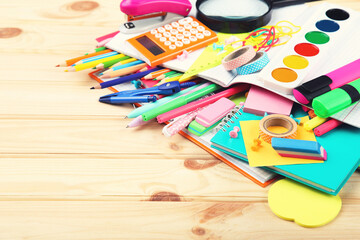 School supplies on brown wooden table