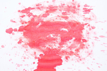 Red abstract stain of watercolor paint on white background.
