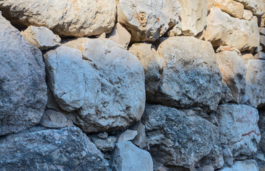 An ancient wall made of rough stones.