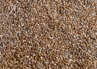 The surface is covered with small pebbles.