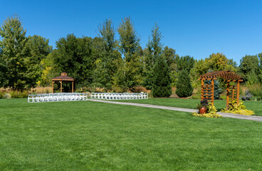 Outdoor Event Venue with Gazebo and White Chairs