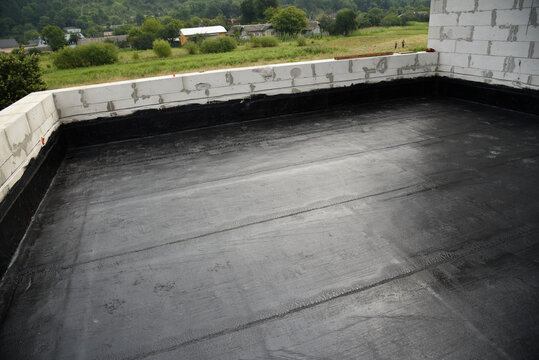 the terrace is covered with a layer of waterproofing roofing material