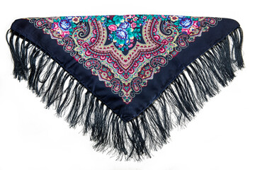 top view on folded pink cotton scarf with fringe and colorful floral ornament