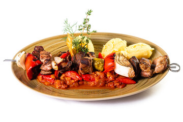 Shish kebab with vegetables on a skewer with paprika sauce