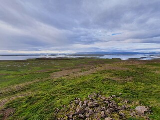 Bare plains and an ocean view with islands, Iceland