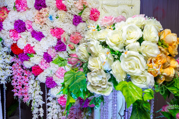 White yellow artificial plastic flowers wedding decoration.