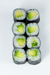 Japanese food. Rolls with ripe avocado, fresh rice with vegetables in nori. Vegetarian rolls