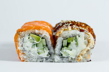 Sushi assorted. Sushi roll with avocado, cucumber. Sushi roll with salmon and caviar. Sushi roll with tuna and caviar. On a light background. Japanese food. View from above