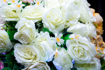 Yellow and white artifical paper flower background. Plastic artificial flower. wedding decoration.