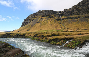 Fototapeta na wymiar Beautiful green and yellow mountainside and river in iceland 