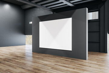 Minimalistic exhibition interior with empty banner on black wall