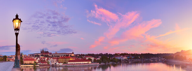 Prague, panoramic image of Charles Bridge and Vltava river at dawn. Panoramic image of Prague...