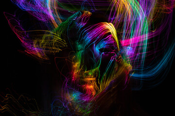 light painting  erotic portrait, light drawing at long exposure, abstract colorful background 
