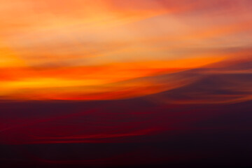 Fototapeta premium Blurry colorful sky in sunset time with wavy camera motion. Abstract background