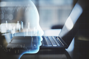 Laptop computer with glowing head with stock chart hologram.