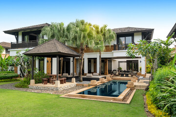 Exterior design of house, home and pool villa feature swimming pool, terrace, landscape garden and sun bed - Powered by Adobe