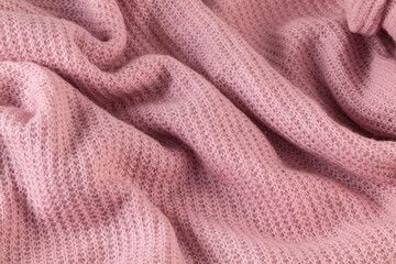 Fototapeta na wymiar Knitted texture. Pattern fabric made of wool.