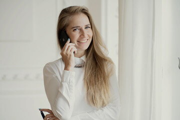 Fototapeta premium young businesswoman talking on phone